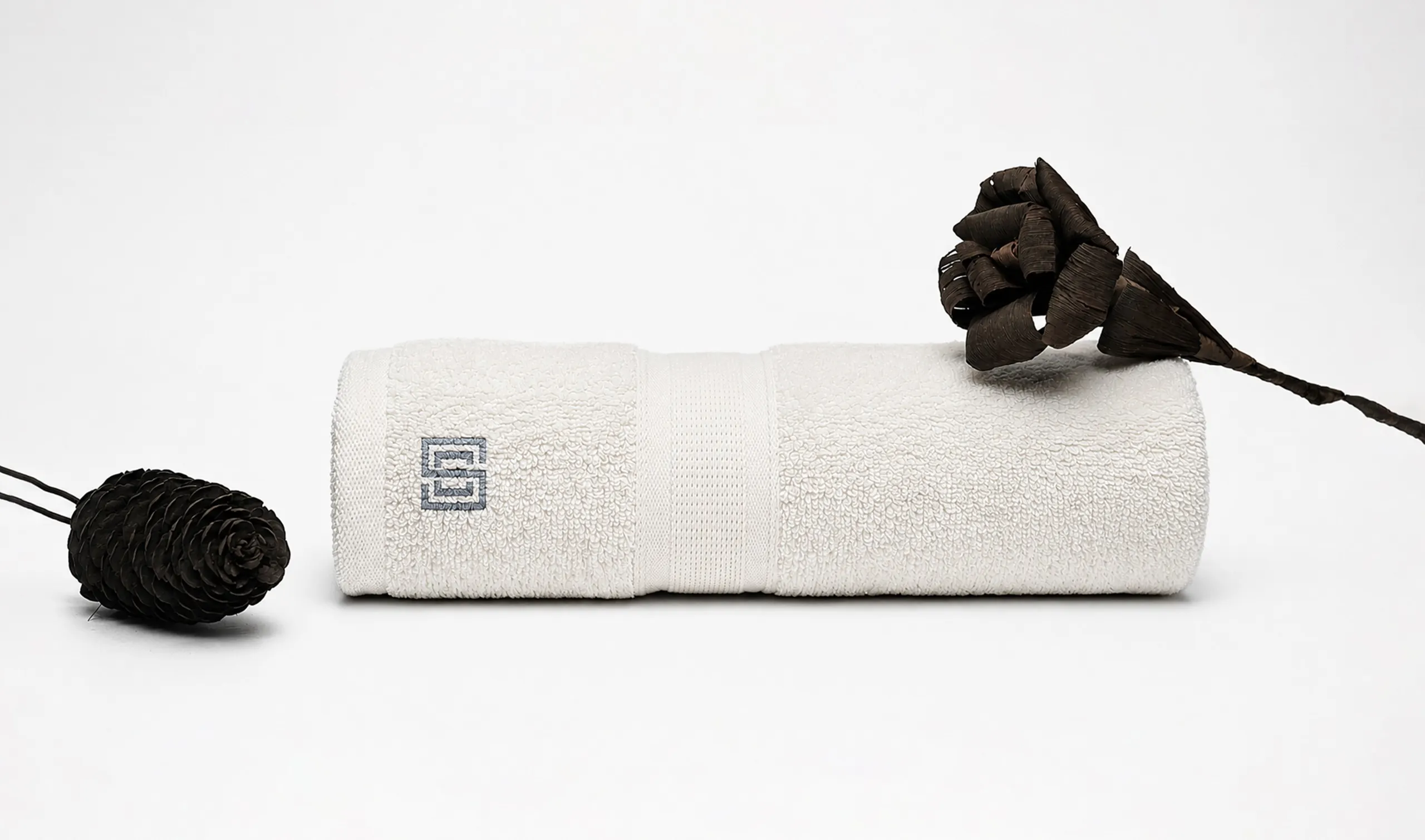 Cro Sea Villas branded amenities β premium towel and accessories art direction